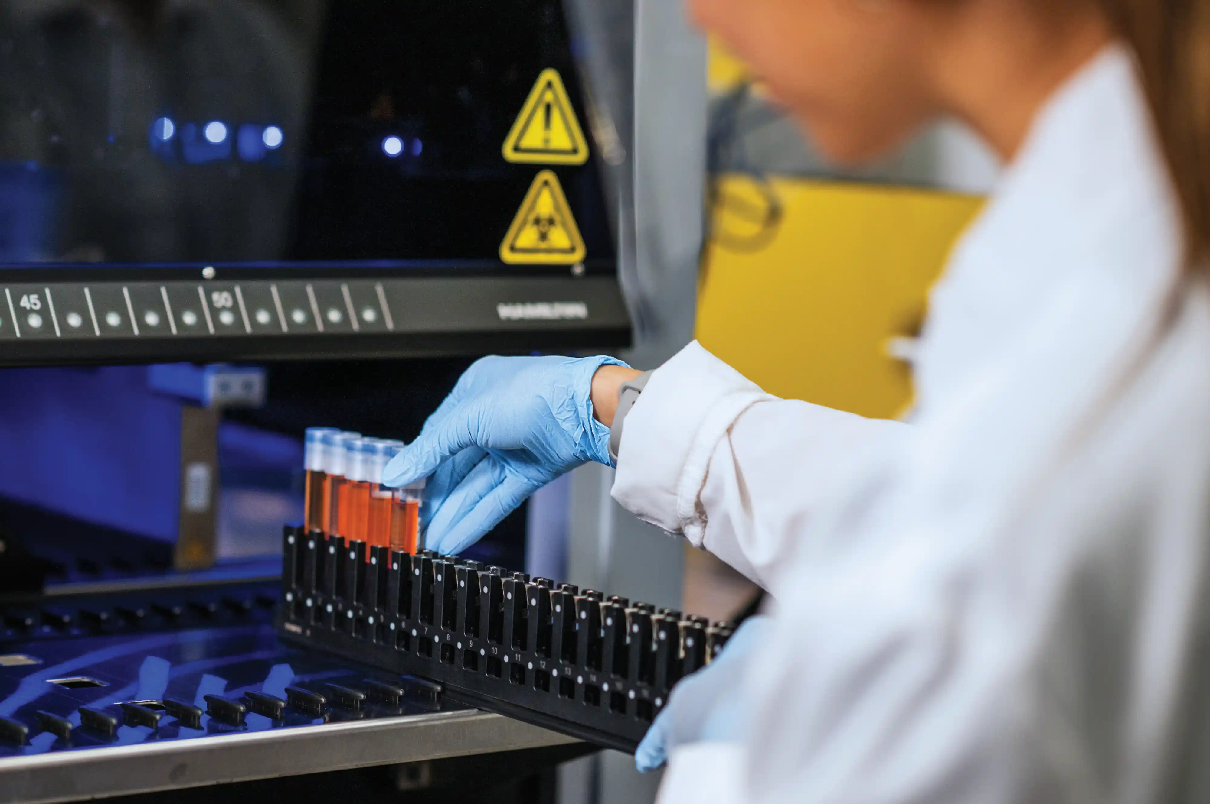 lab worker testing vials