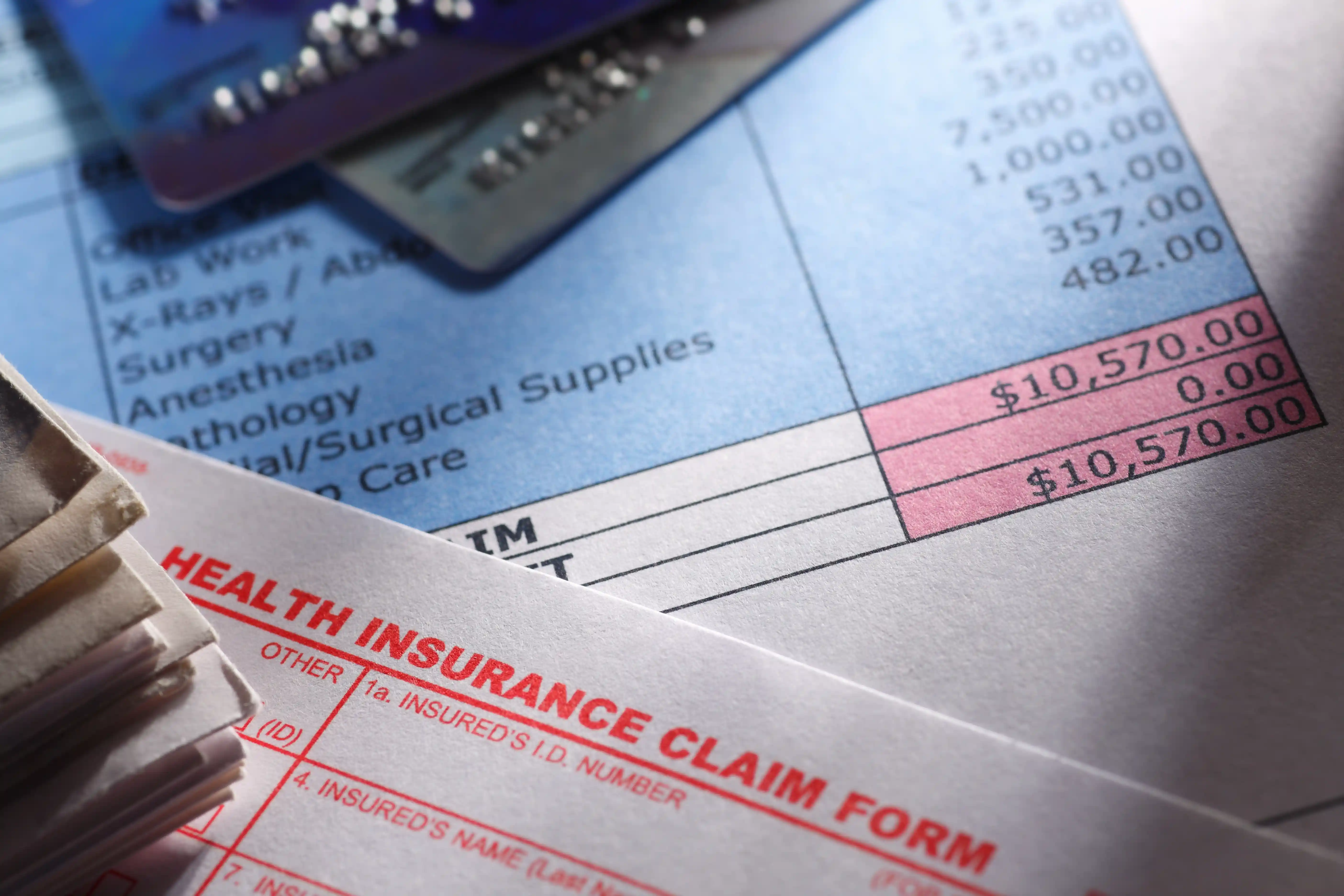 health insurance claim forms pile