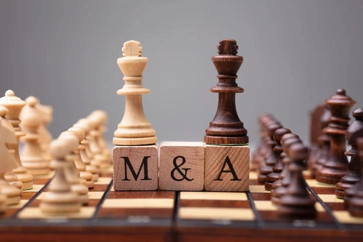 chess pieces on "M & A" blocks