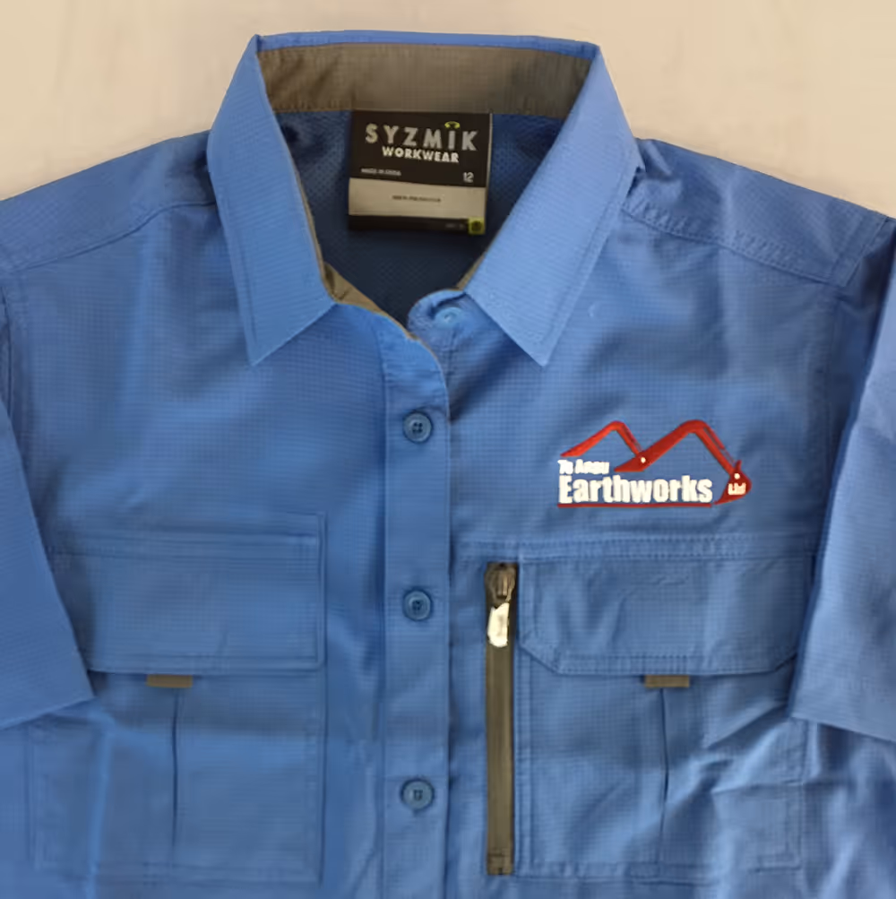 An embroidered with the Te Anau Earthworks logo on the front