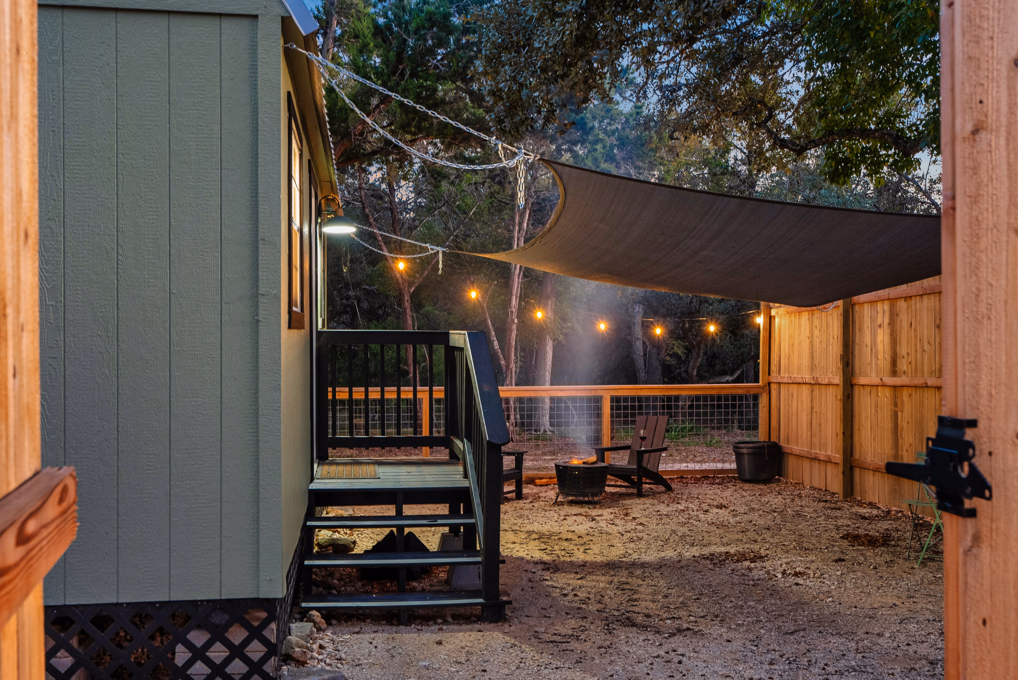Patio of a property with cozy seating around a fire pit