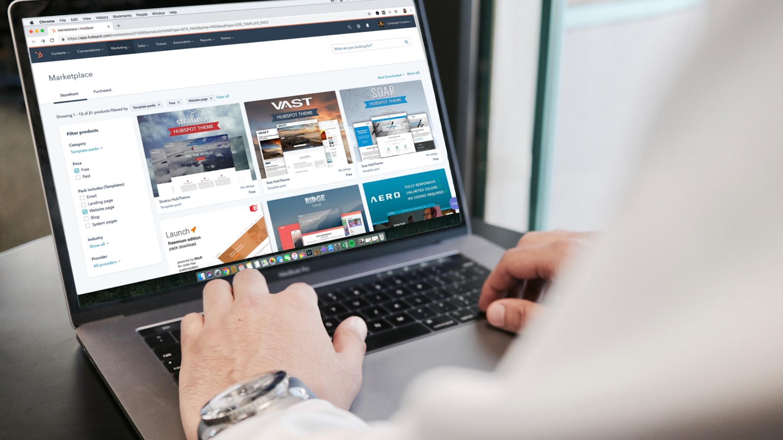 A laptop showing a travel booking website, illustrating expanding a short-term rental beyond Airbnb to VRBO and more