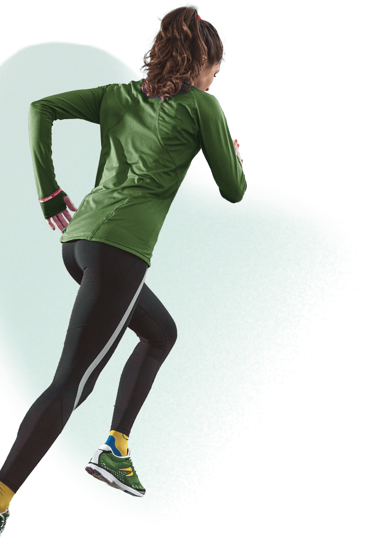 A runner mid sprint, running away from the viewer.