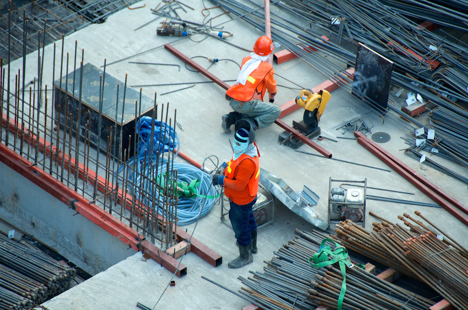 Wide view of an active building site with steel and concrete works underway