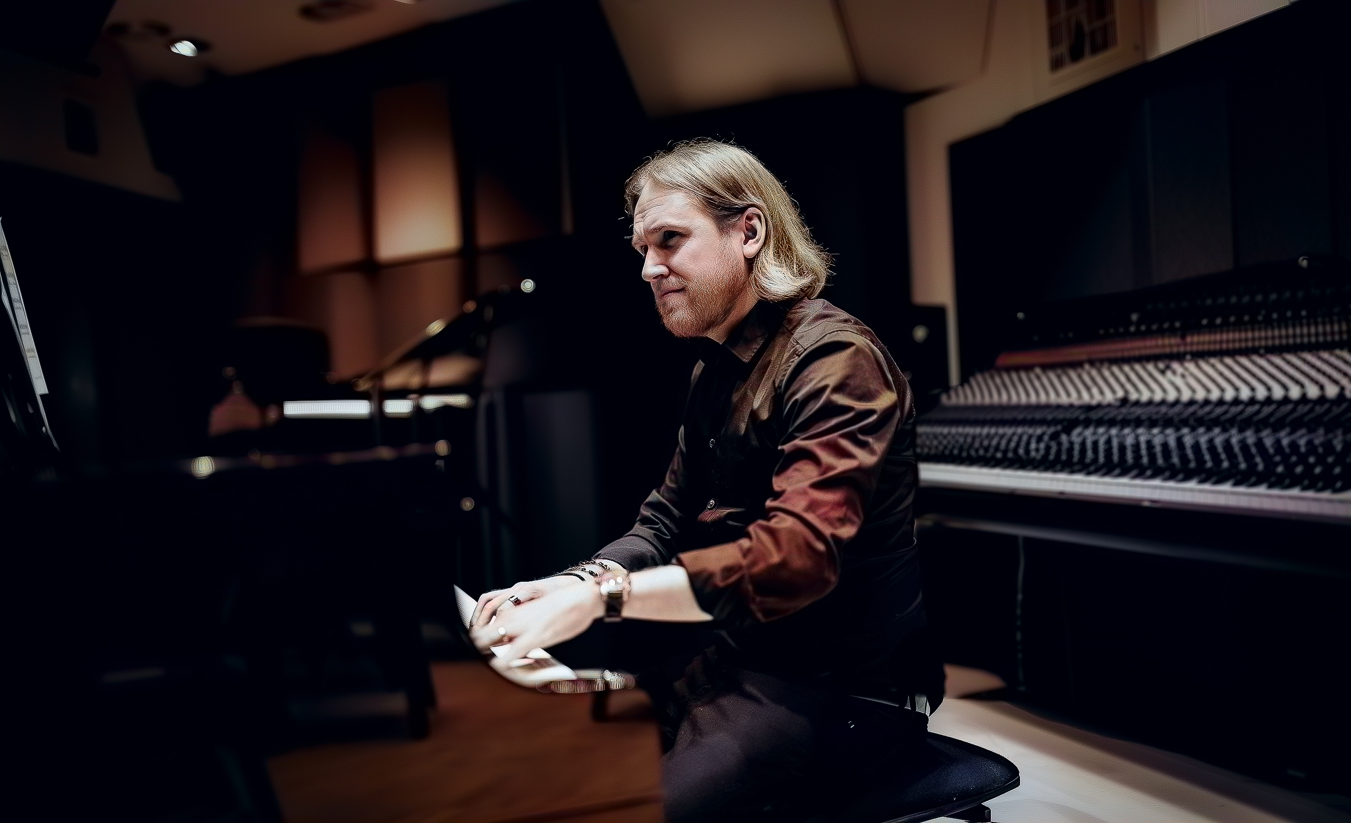 Grammy-nominated music producer in a recording studio