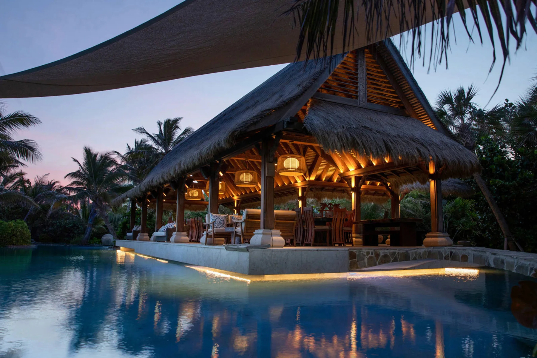 The Crocodile Pavilion lit at night on Necker Island