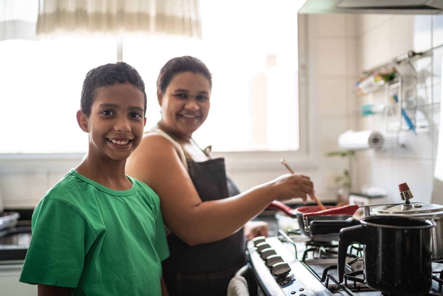 A young carer at home with his mum