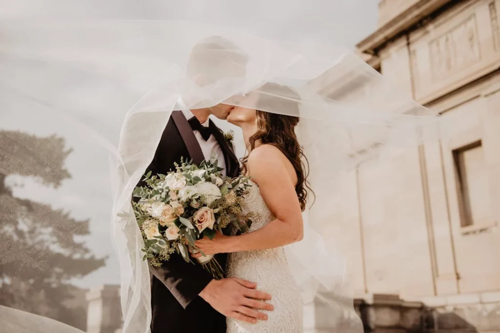 happy couple kissing at a wedding