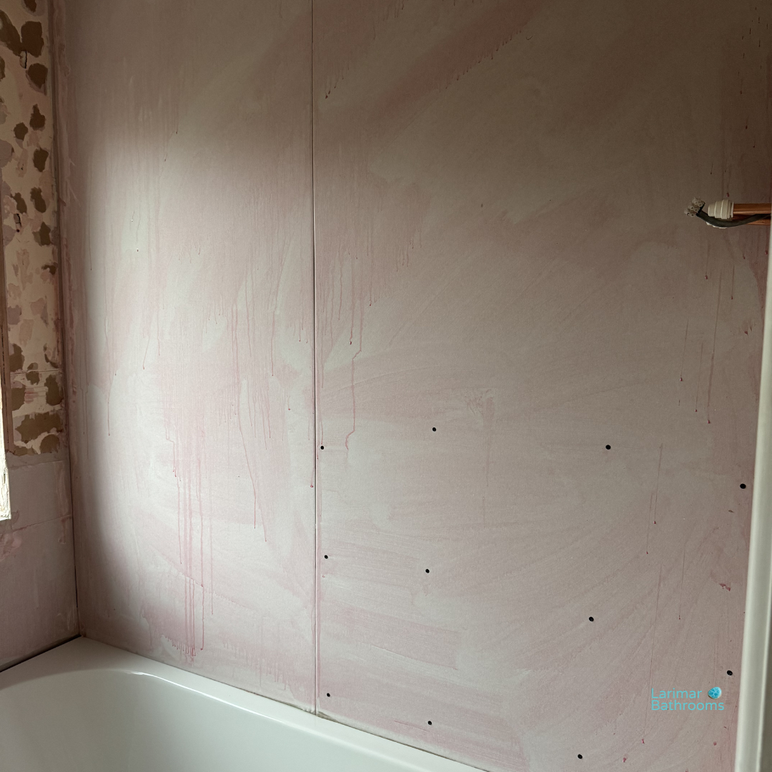 Fresh plasterboard fitted to bathroom walls before tiling