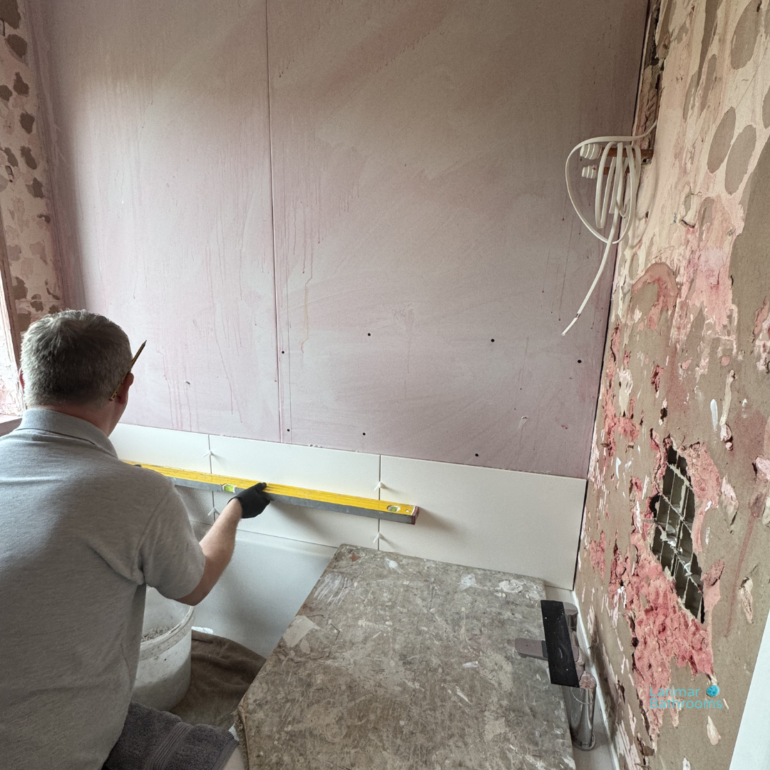 Porcelanosa 30x60 ceramic tiles being fitted in straight bond pattern