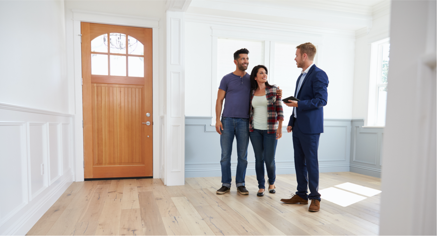 Realtor Showing Couple Around New Home