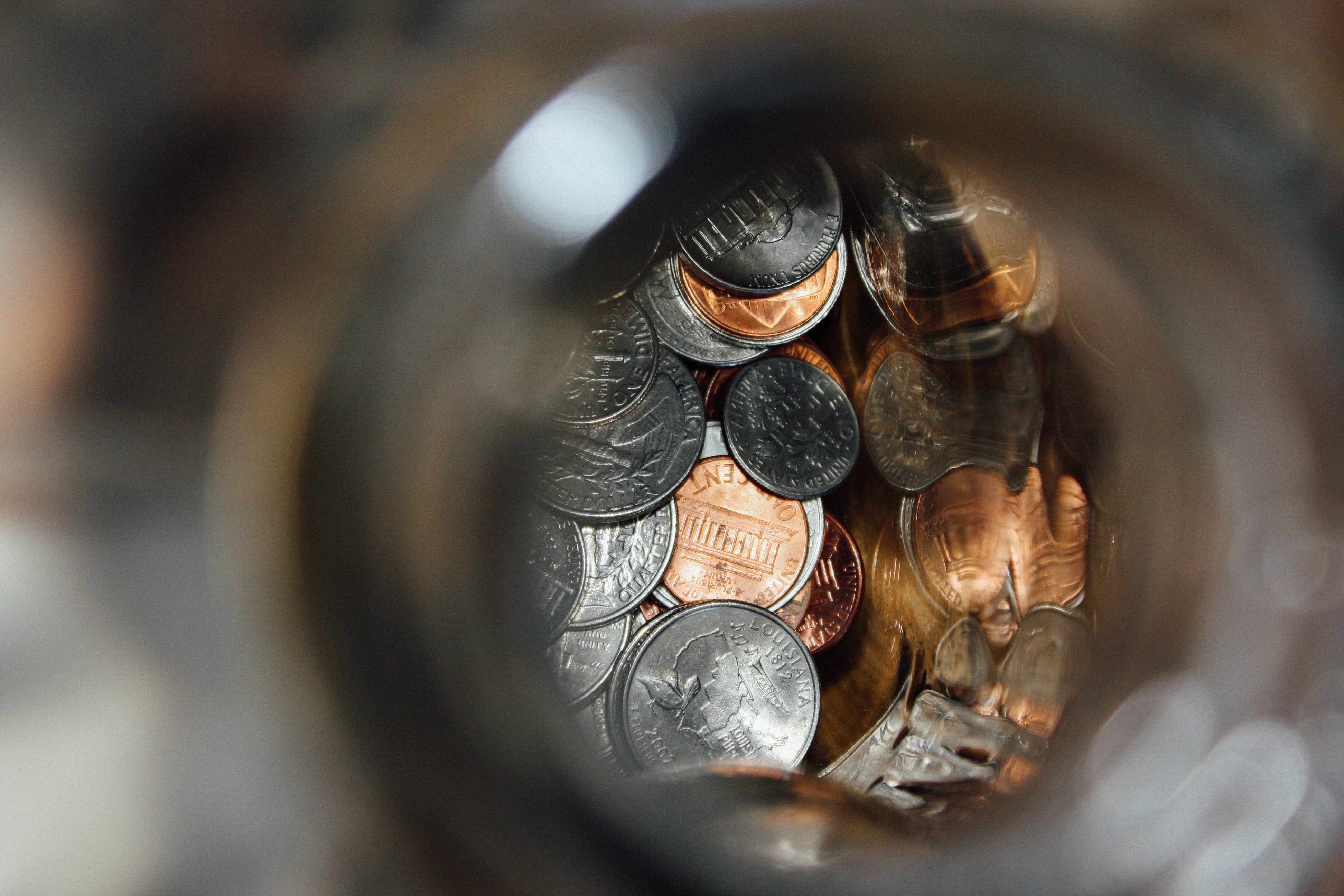 Savings jar containing change with a view from above.