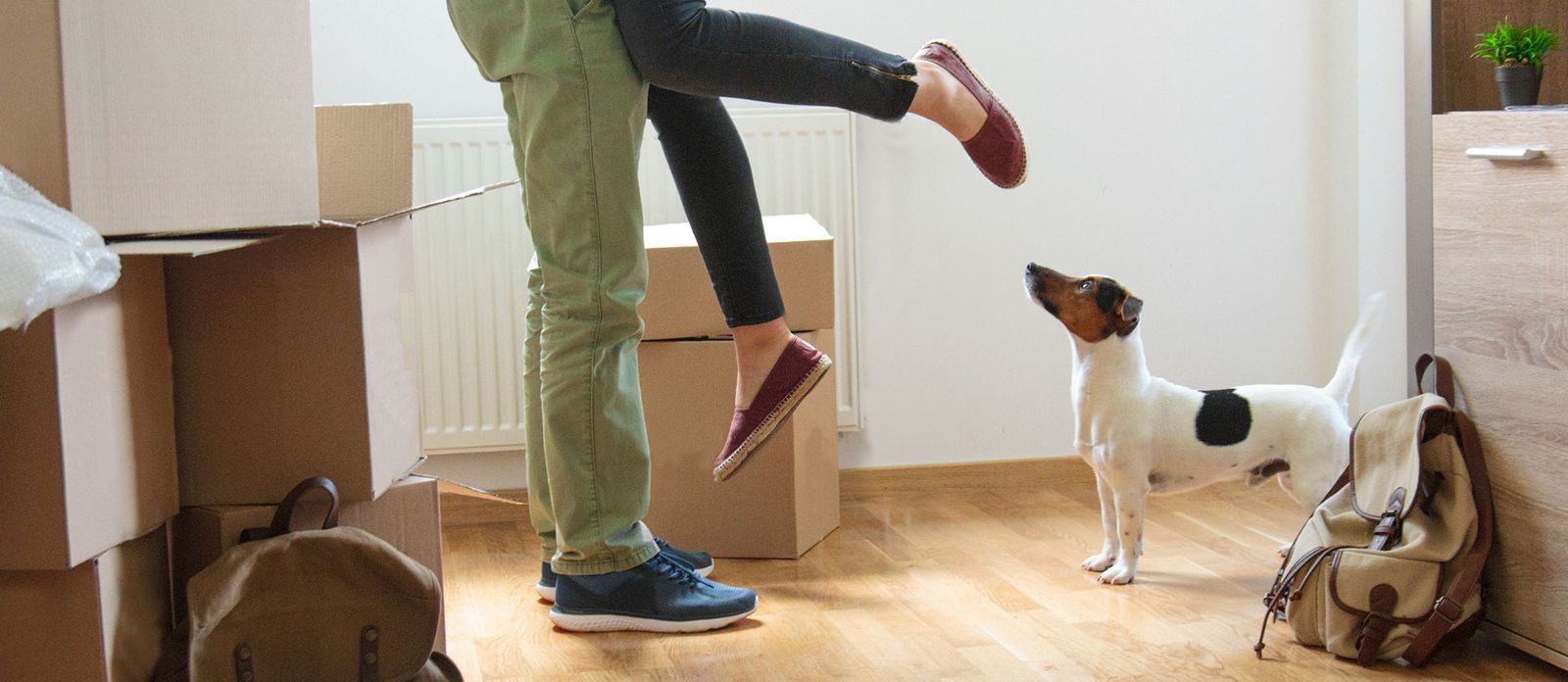 Couple hugging in house. Mortgage Closing Costs What Are They and How Much Will I Pay?