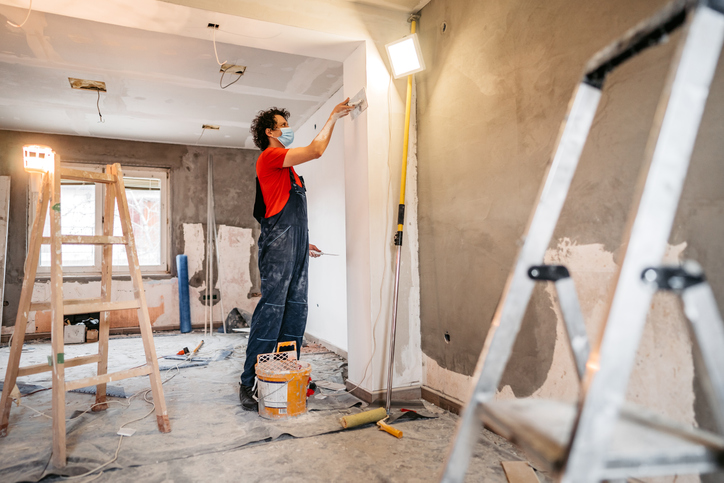 Man painting new home.