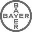 Bayer company logo with the word Bayer written vertically and horizontally inside a circle.