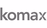 Komax company logo in lowercase gray letters.
