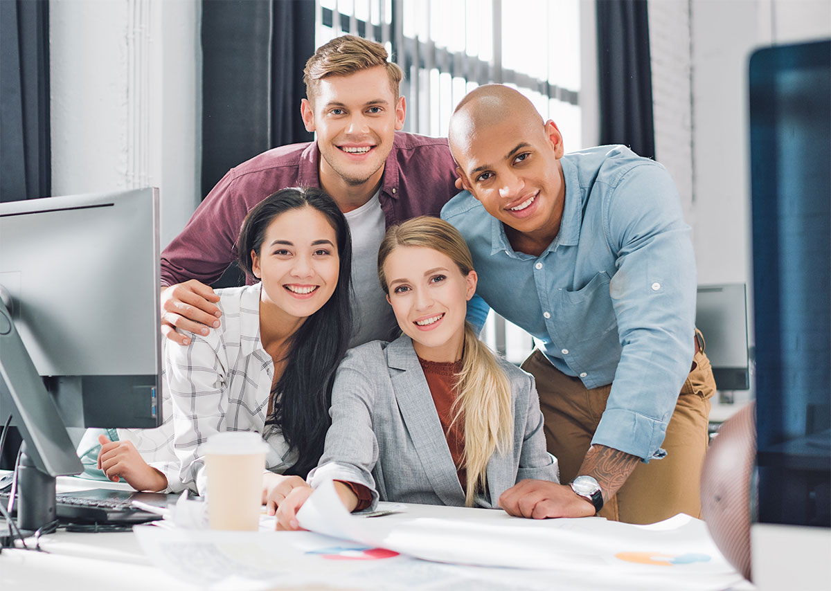 four employees in an office