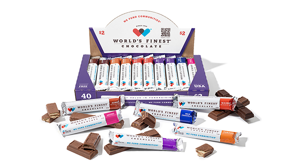 Box of 40 World's Finest Chocolate bars in assorted flavors including almond, pretzel, milk chocolate, caramel, and wafer with some bars unwrapped.