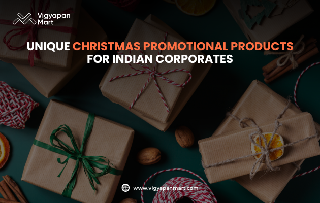 Christmas corporate gift boxes wrapped in brown paper with natural ribbons and dried fruit, promotional banner for Vigyapan Mart reading "Unique Christmas Promotional Products for Indian Corporates.