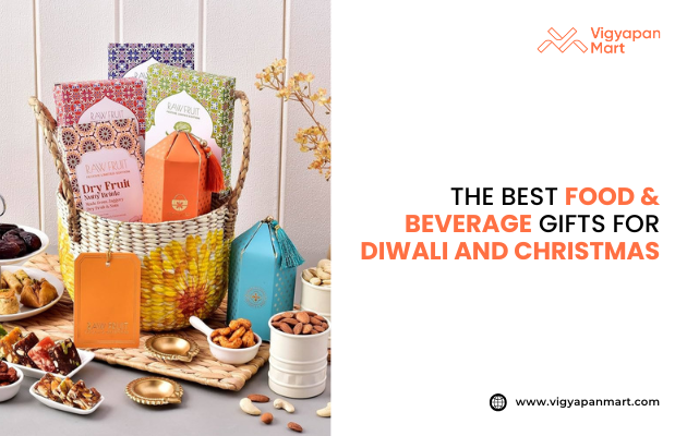 Festive gift hamper featuring assorted dry fruits, snacks, and premium packaged treats in a decorative basket with colorful boxes and tins. Display includes nuts, sweets, and festive décor, promoting “The Best Food & Beverage Gifts for Diwali and Christmas” by Vigyapan Mart. Ideal for festive gifting, holiday hampers, and Diwali or Christmas gift ideas. Website: www.vigyapanmart.com