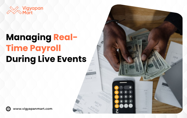 Two hands hold U.S. dollar bills over a cluttered desk with a calculator and papers. The image's focus is on real-time payroll management.