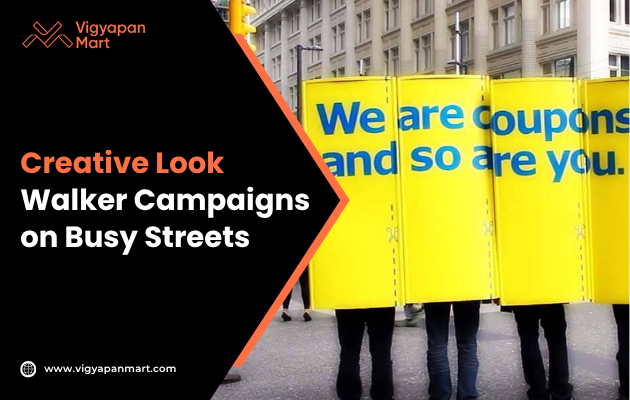 Four people on a busy street hold bright yellow boards with bold blue text reading "We are coupons and so are you," creating a vibrant and engaging street campaign backdrop.