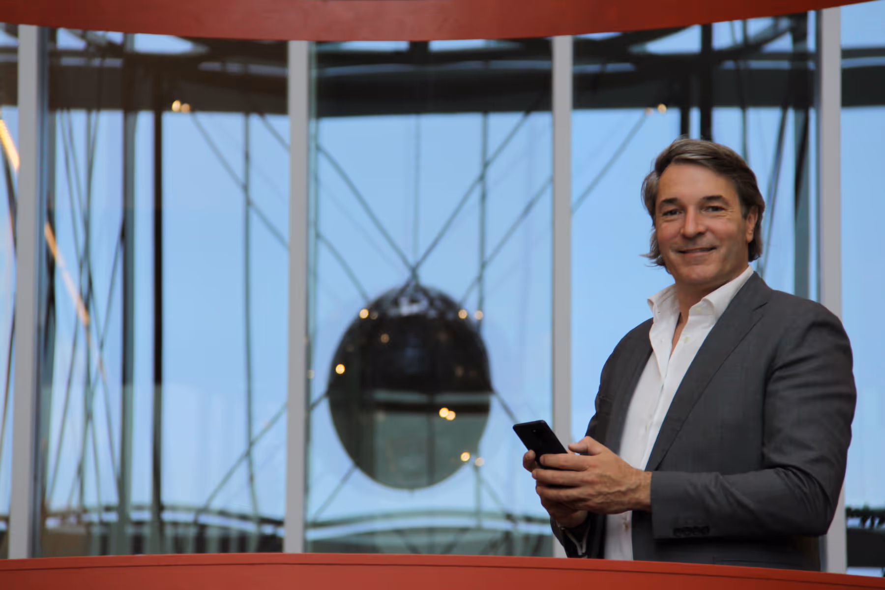 Carsten looking into camera while having the Dutch Incorporation Services office in the background