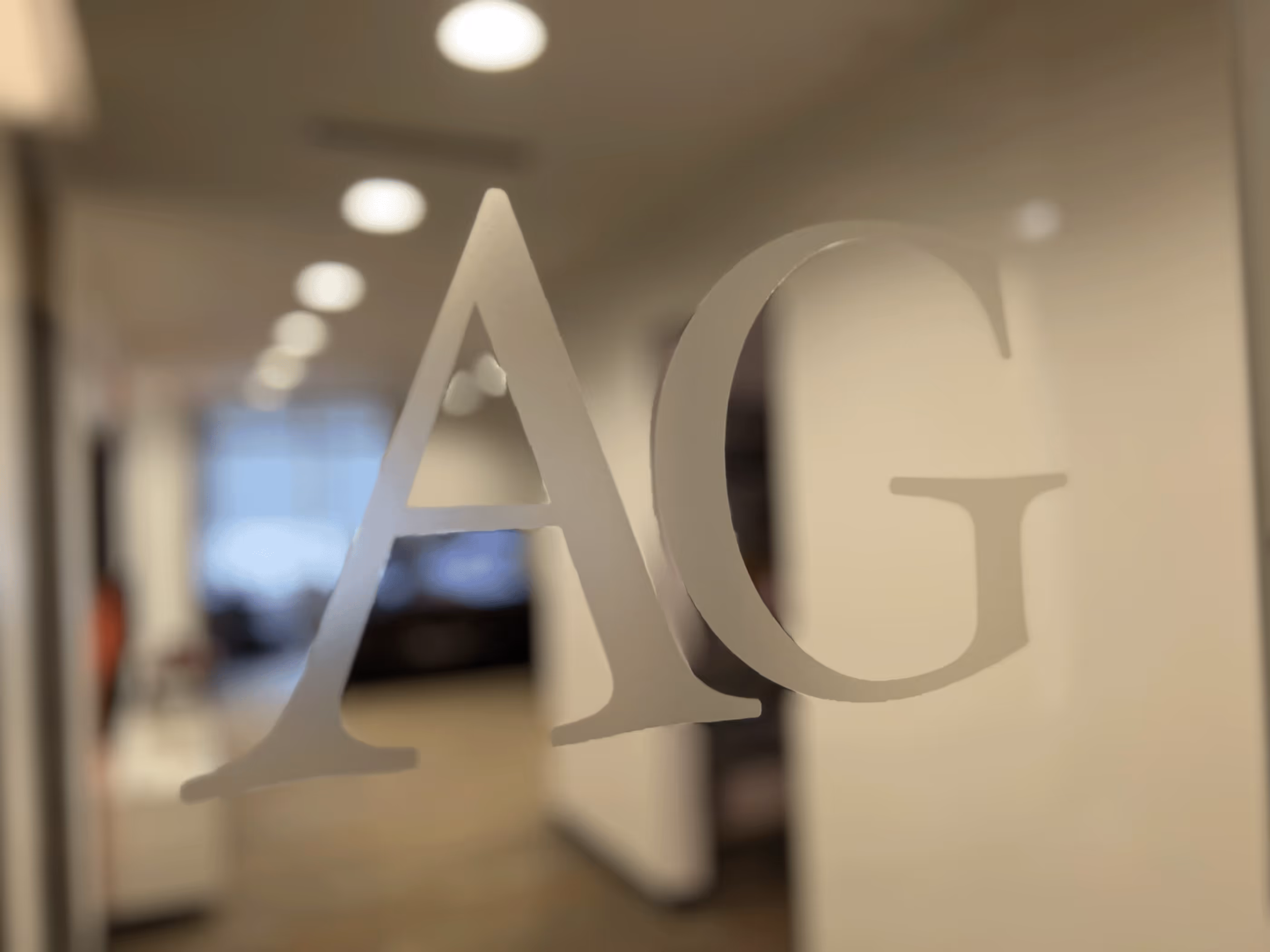 Frosted A G letters on window