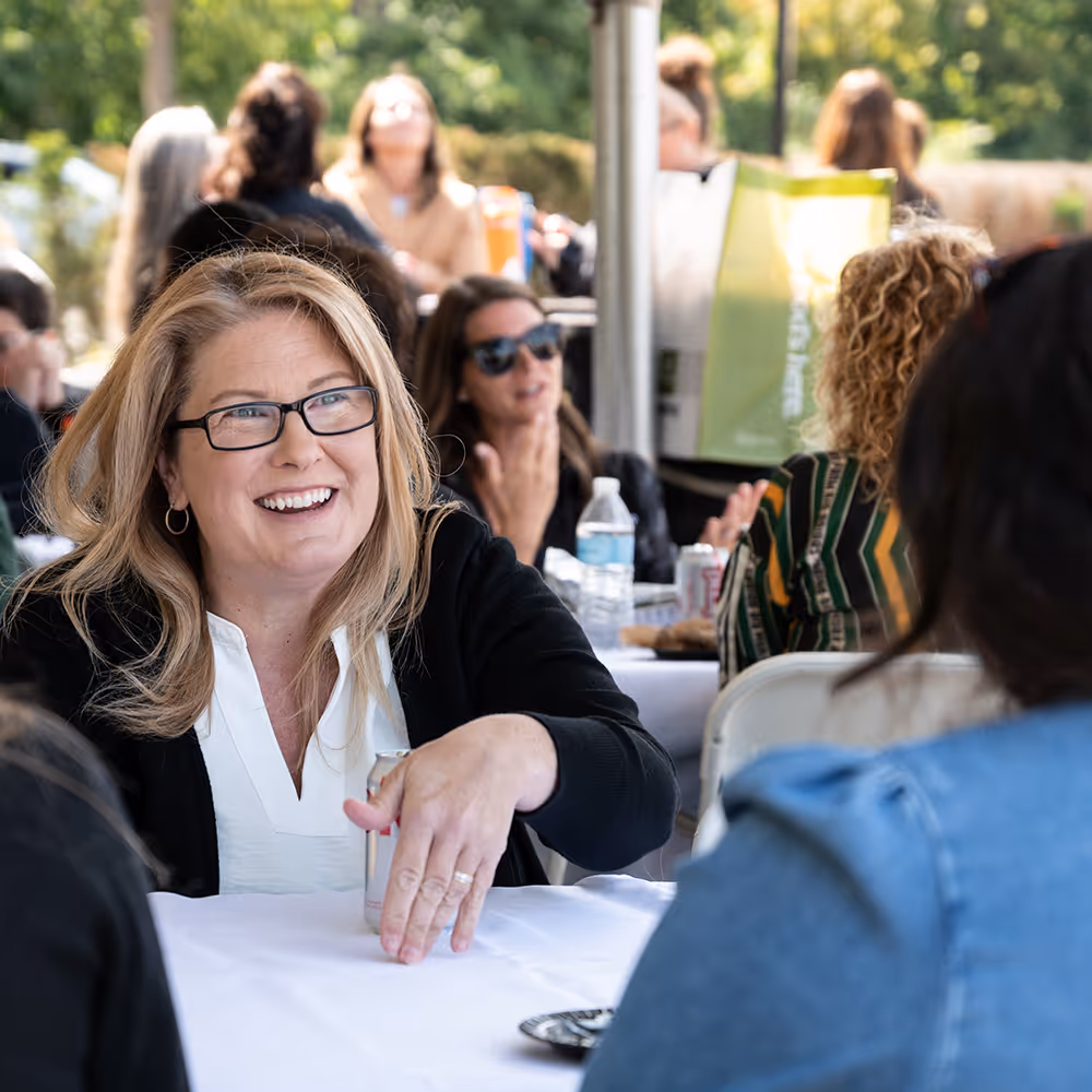 Alteris employees in conversation at corporate event