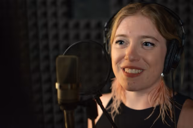 Smiling women in recording booth