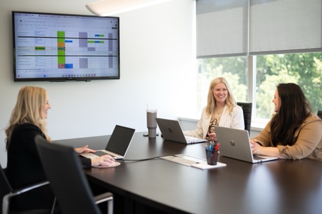 small group of employees in conference room meeting