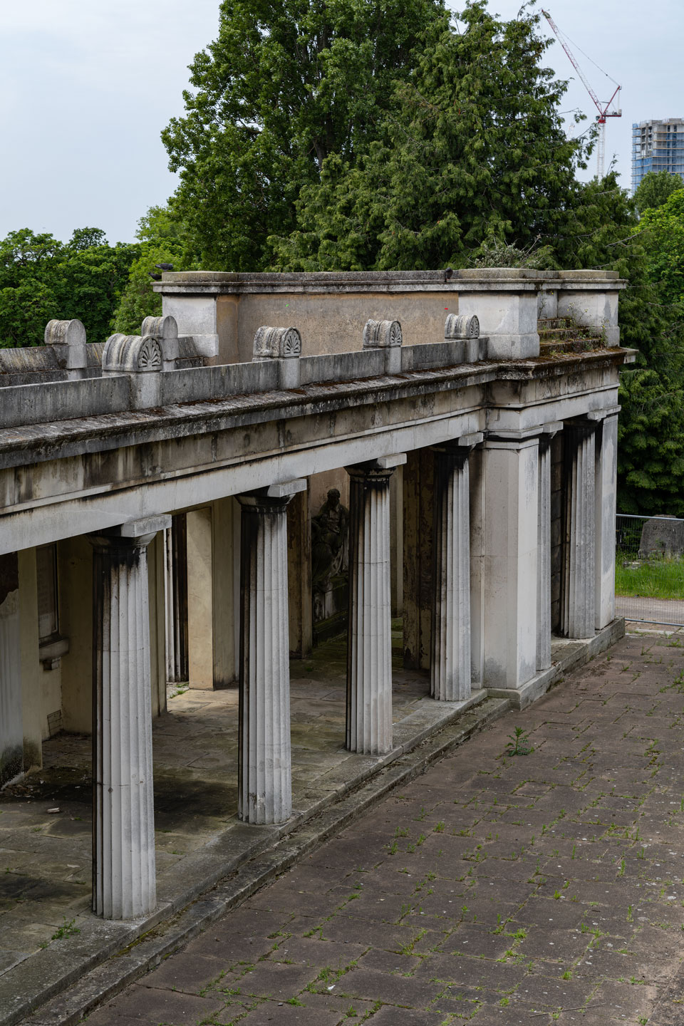 View of historic cemetery building colonnade.