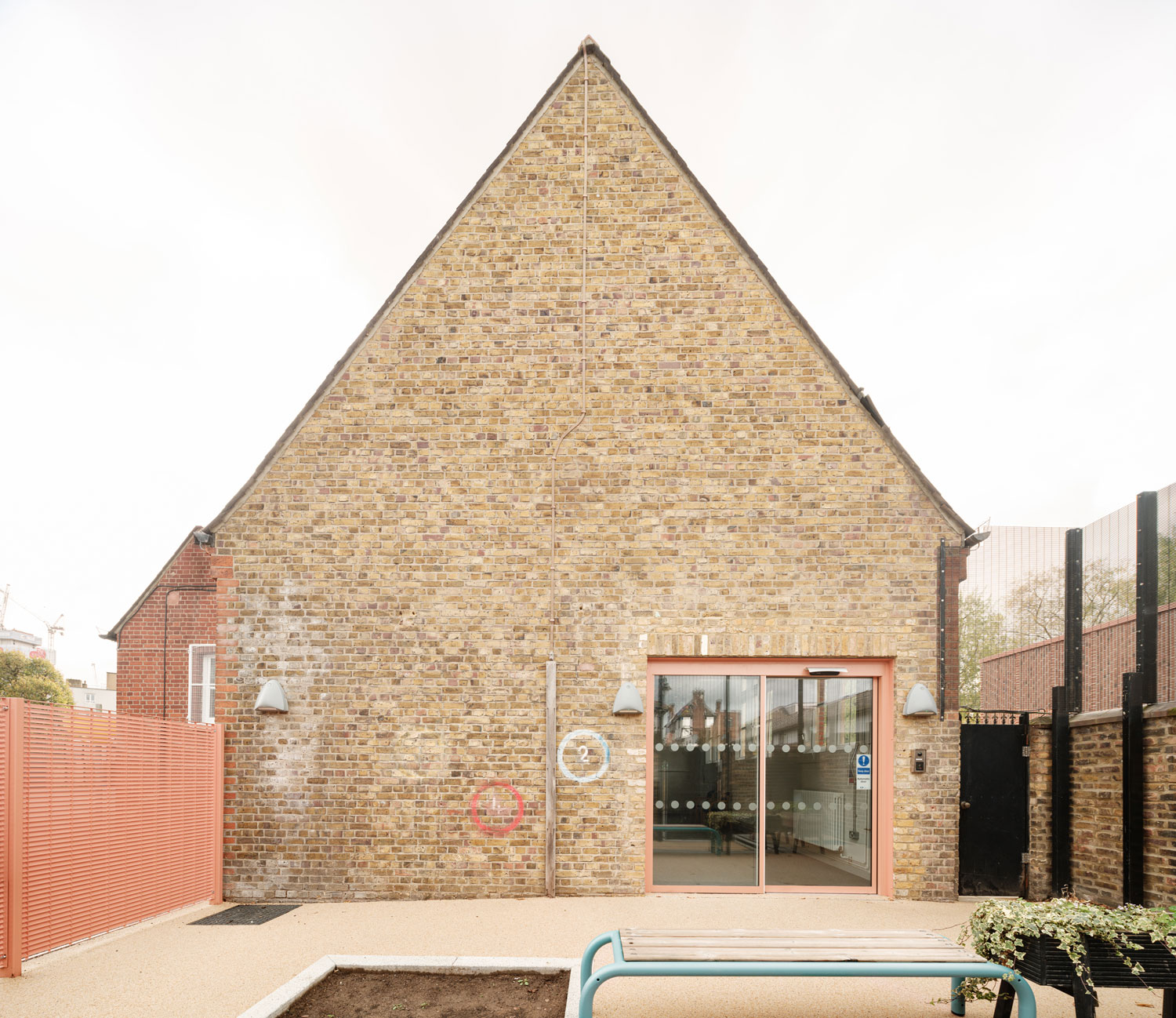 Elevation of the new classrooms, highlighting the pitched-roof form.