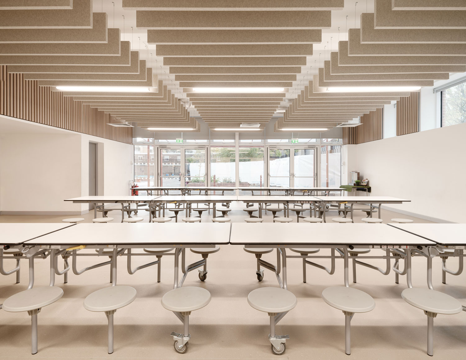 The new dining space at Riverside, featuring bright acoustic panelling across the ceiling.