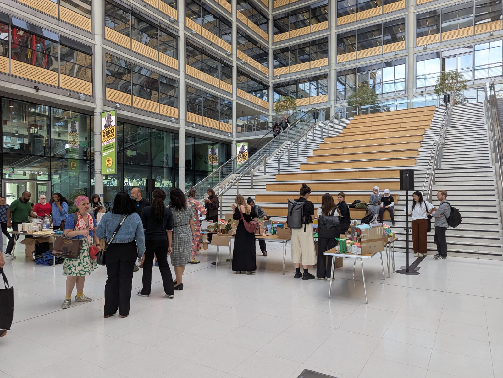 A photo of the guests in the foyer of the civic centre observing the incredible
models made by the students.