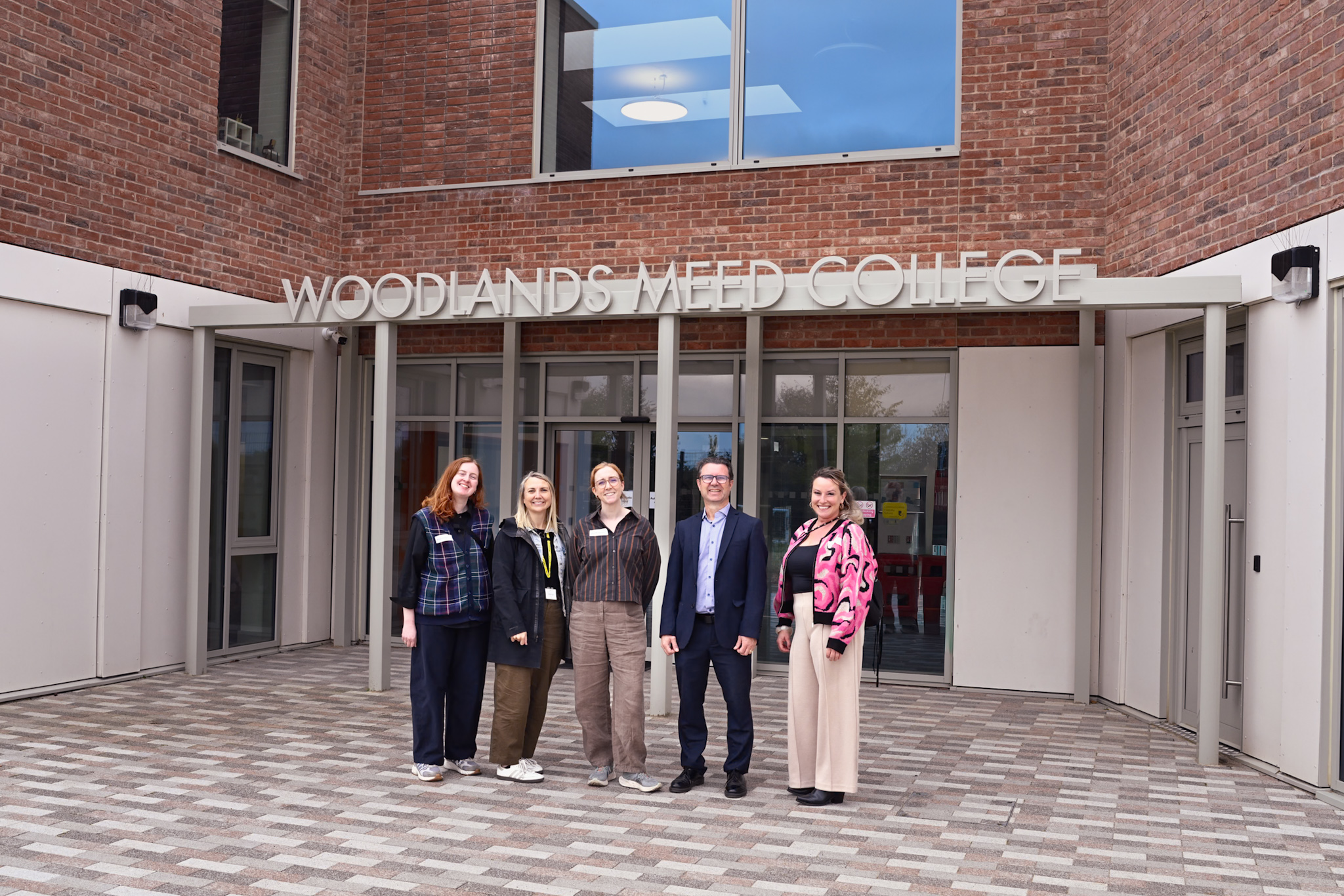 Kirsten, Claire, Anna and the team at Woodlands Meed College outside of the new school