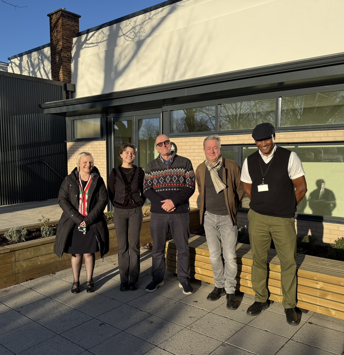 A photo of Bessie and the extended team who worked
on the project,they are stood outside the building. Bessie is
second from the right wearing black.