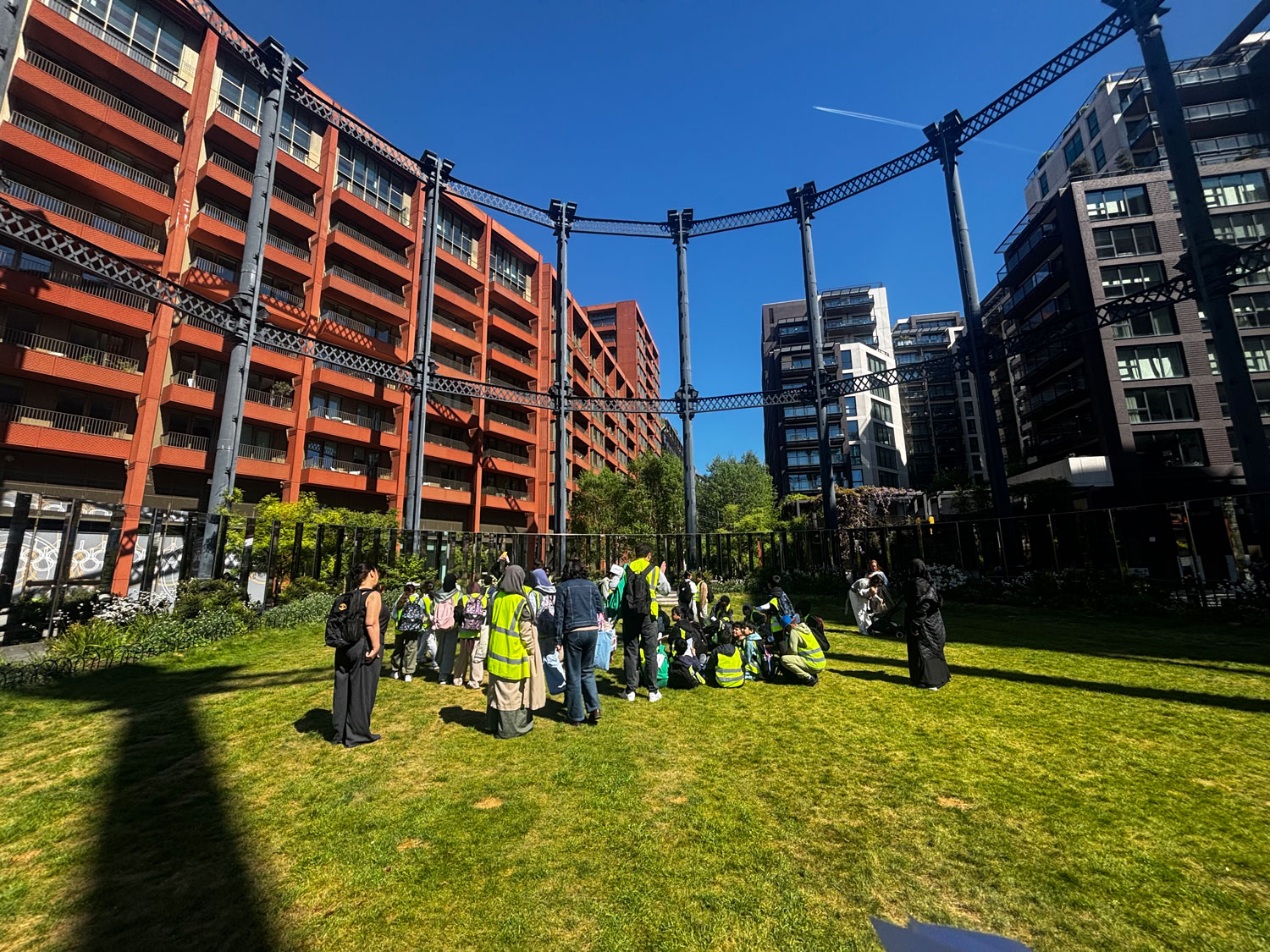 Gasholders Park, students sit and explore the biodiverse planting.