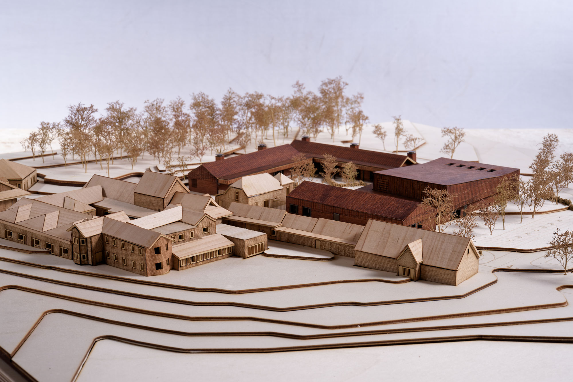 A view of the model now facing northeast. For this view the wider sloped landscape is illustrated, with the proposed Centre in proportion to the existing buildings.