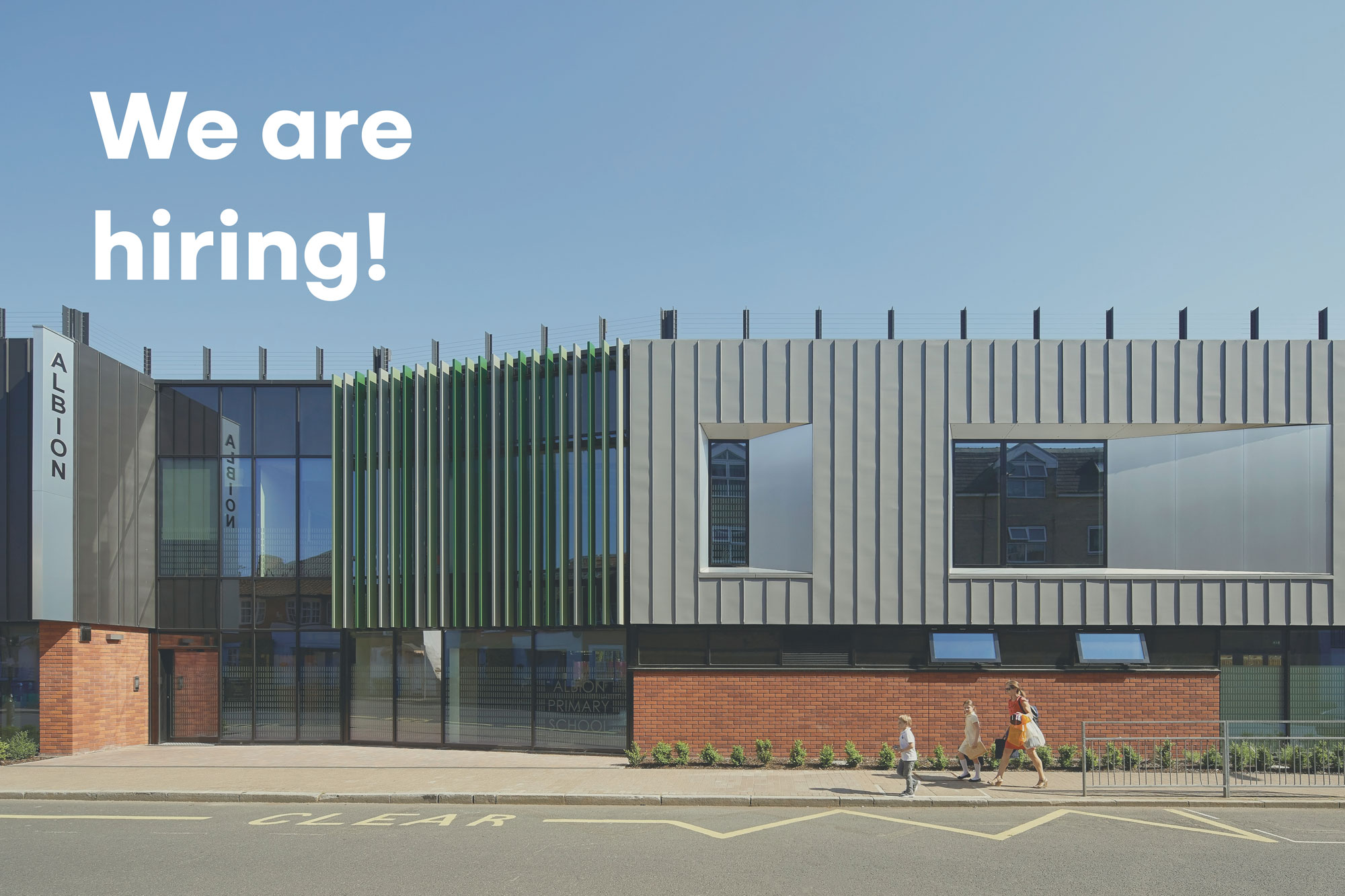 A photo of Albion Primary School, with a light overlay. The overlay reads 'We are Hiring'. 