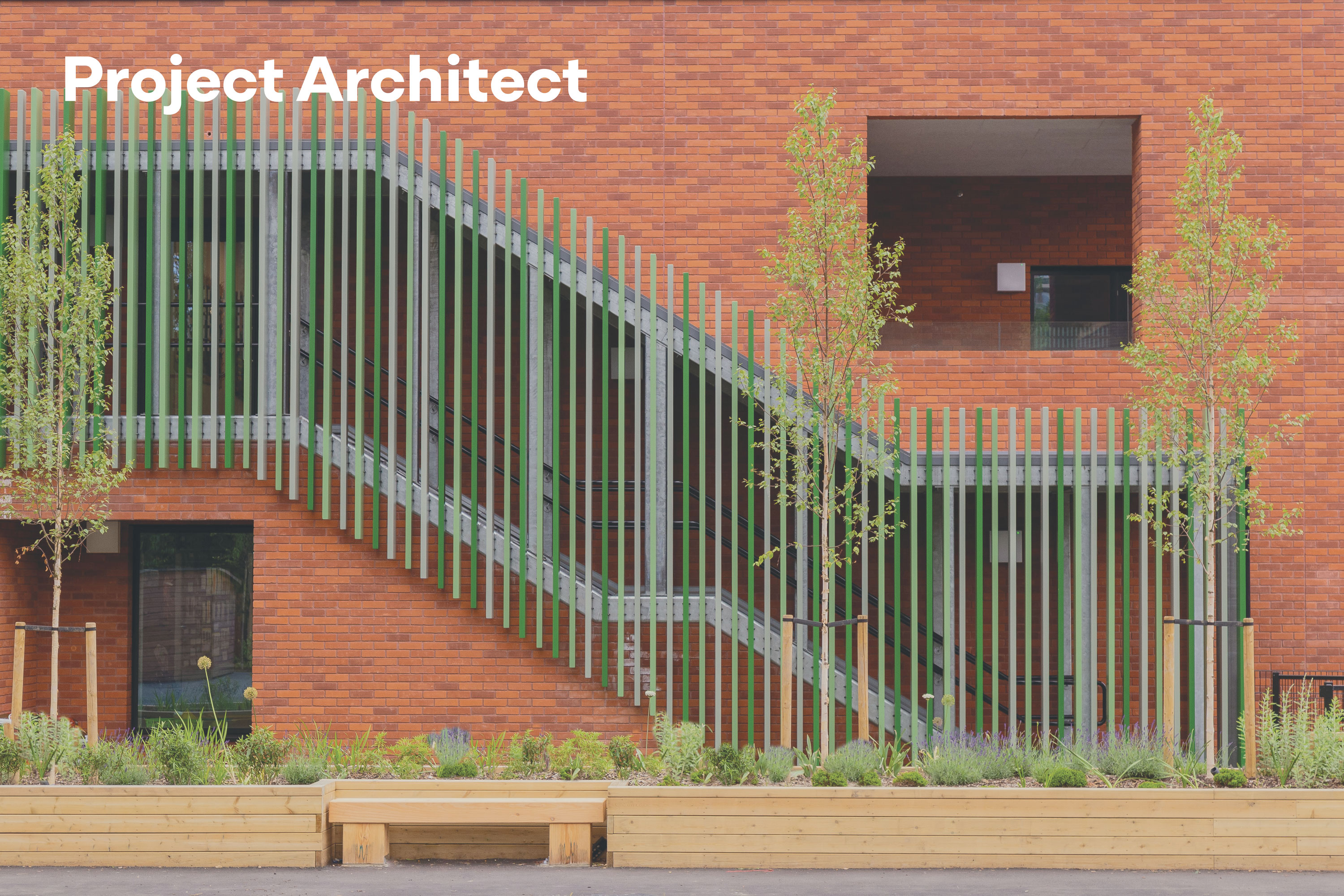 A photo of the brickwork and coloured staircase on the exterior of Albion Primary School. Text in the upper left reads 'Project Architect'
