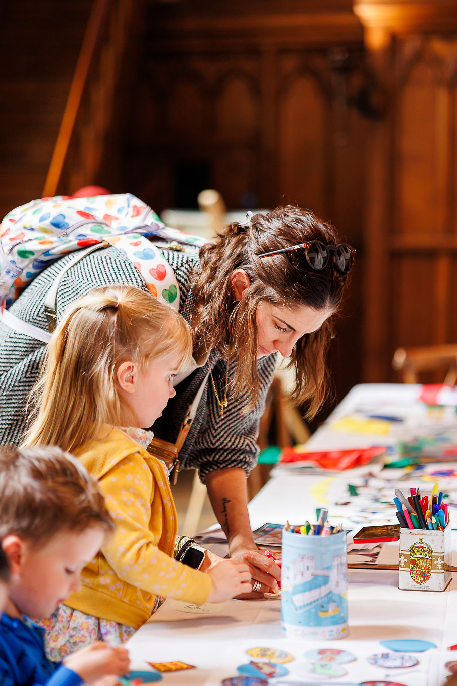 A woman and child take part in the crafts events in the Stone Hall.

