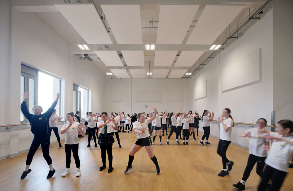 A photo of students dancing in the new studio.