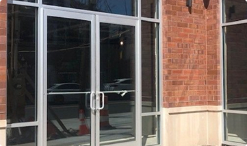 Glass doors with an aluminum frame.