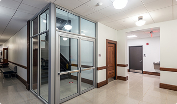 Glass doors with an aluminum frame.