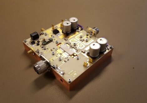 Close-up of Doherty PA circuit board with capacitors and connectors.