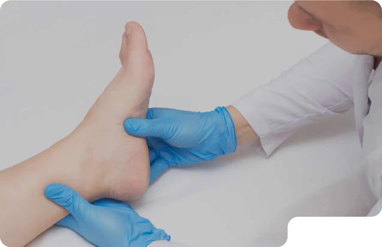 Foot doctor in Beverly Hills examines patient’s foot