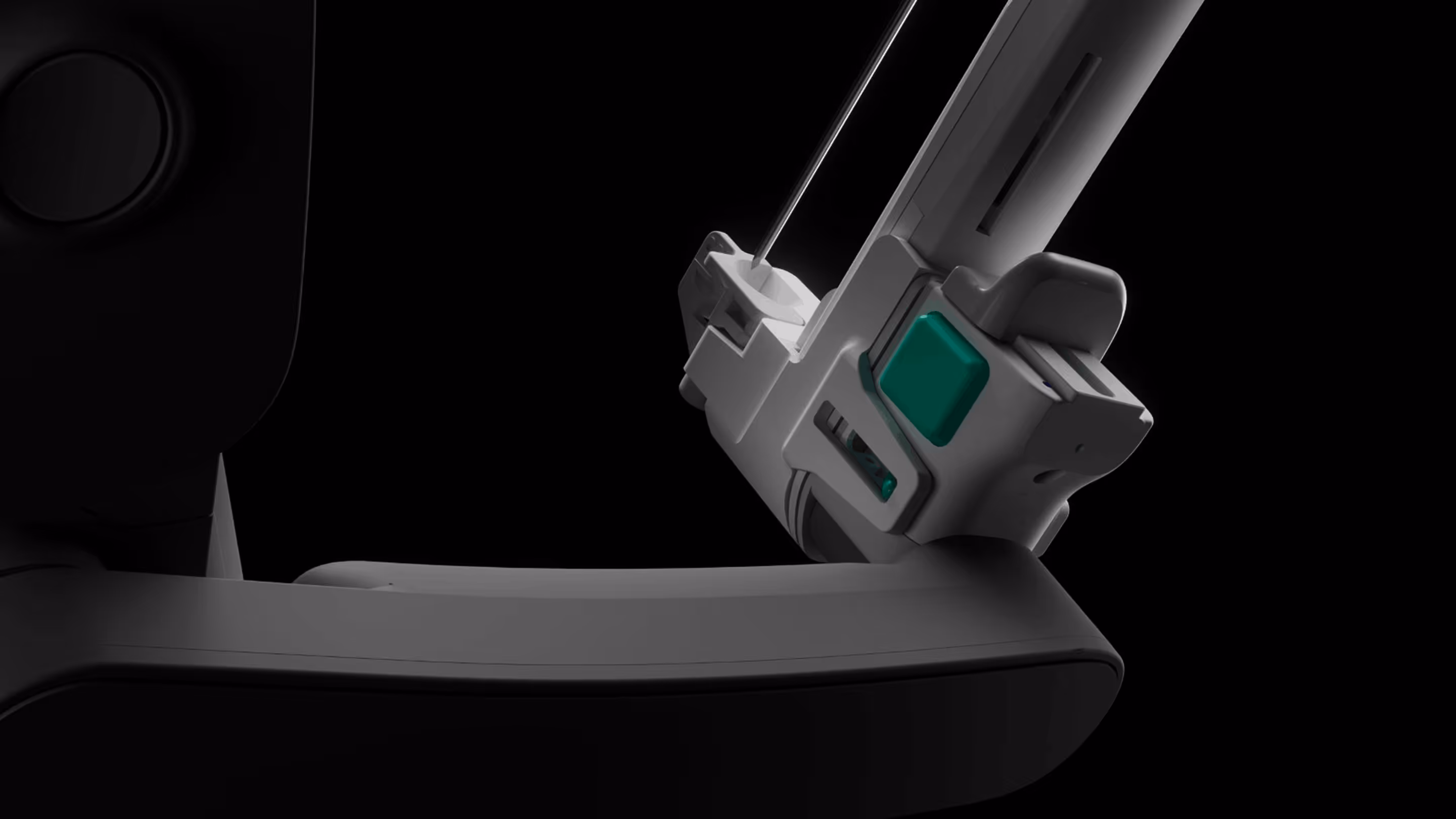 Close-up of a modern medical device or robotic equipment with a needle against a black background.