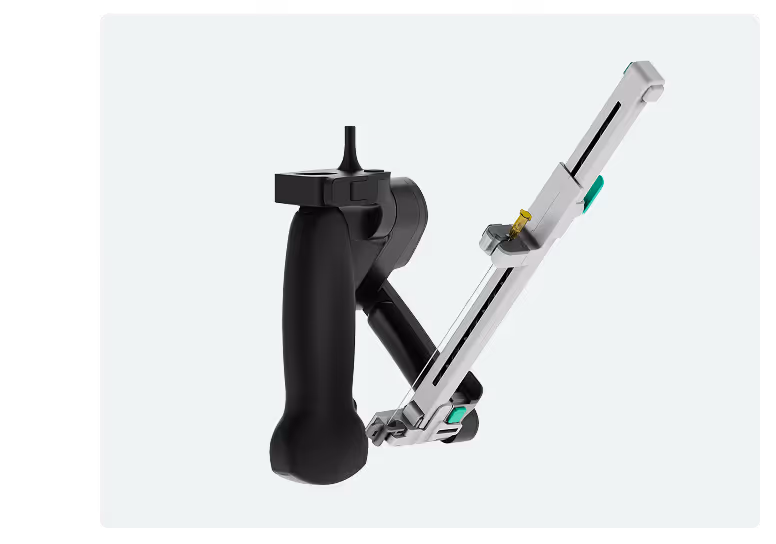 Handheld surgical robotic device with black grip and attached metallic arm.