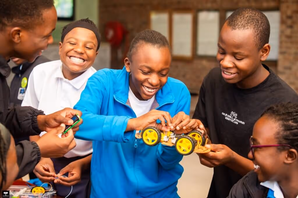 students playing with rebotic cars